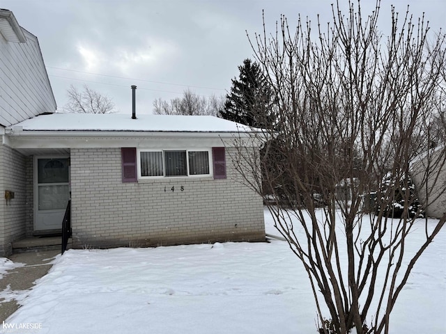 view of snow covered property