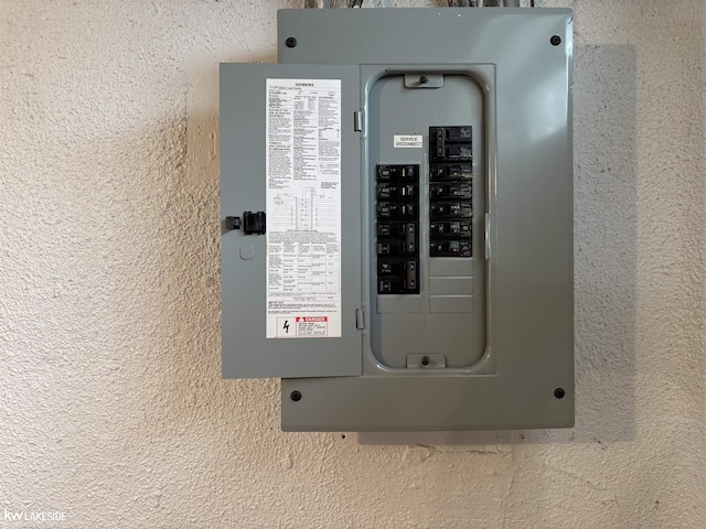 utility room featuring electric panel