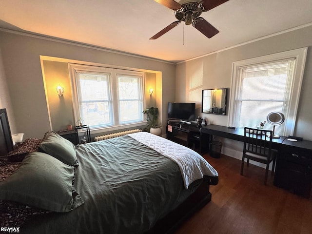 bedroom featuring ceiling fan, dark wood-type flooring, and ornamental molding