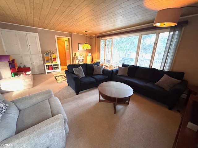 carpeted living room with ornamental molding and wood ceiling