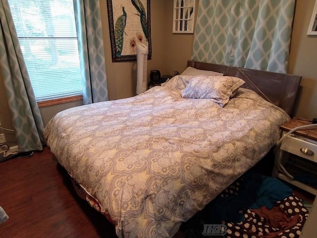 bedroom featuring dark hardwood / wood-style floors