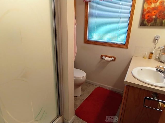 bathroom featuring walk in shower, tile patterned flooring, vanity, and toilet