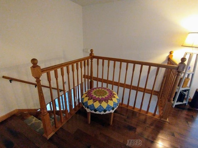 staircase featuring hardwood / wood-style floors