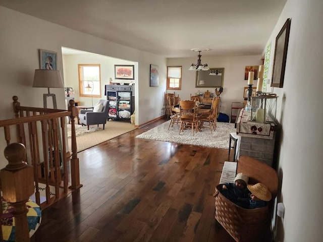 dining room featuring a notable chandelier and dark wood-type flooring