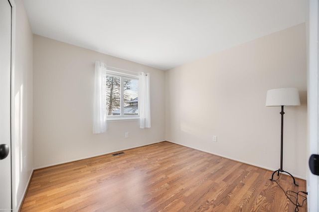 unfurnished room featuring light hardwood / wood-style floors