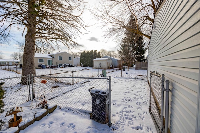 yard layered in snow with central AC unit