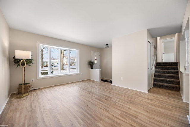 unfurnished living room with light hardwood / wood-style floors