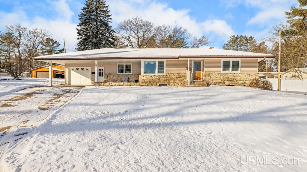 ranch-style home with a garage