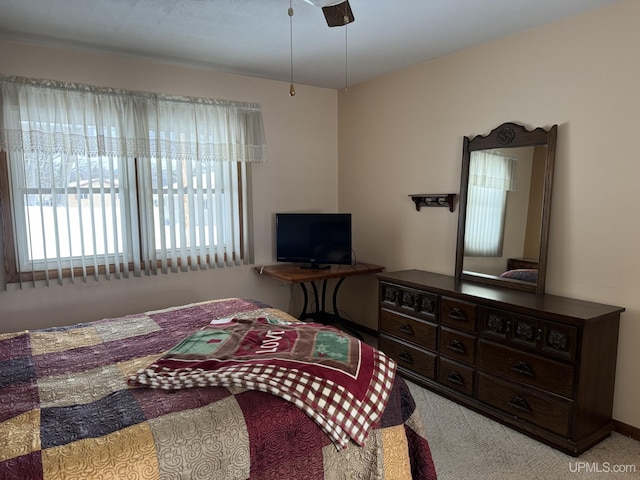 carpeted bedroom featuring ceiling fan