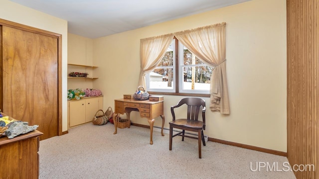 sitting room featuring light carpet