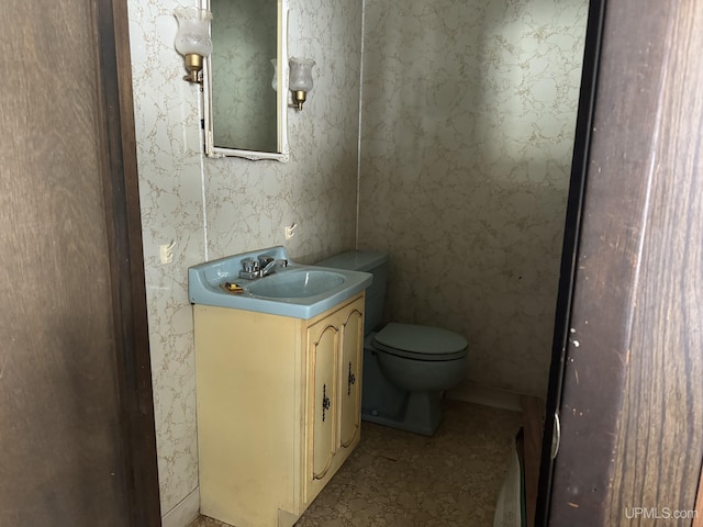 bathroom with toilet and vanity