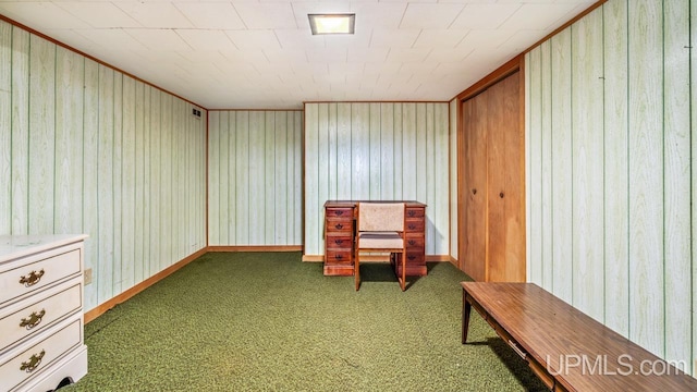 sitting room with dark colored carpet