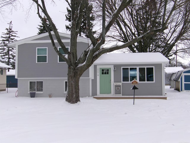 view of front facade with a shed