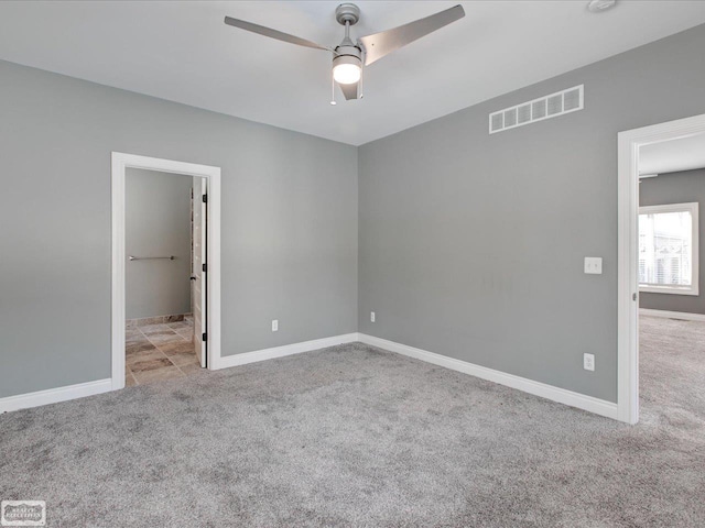 empty room with light carpet and ceiling fan