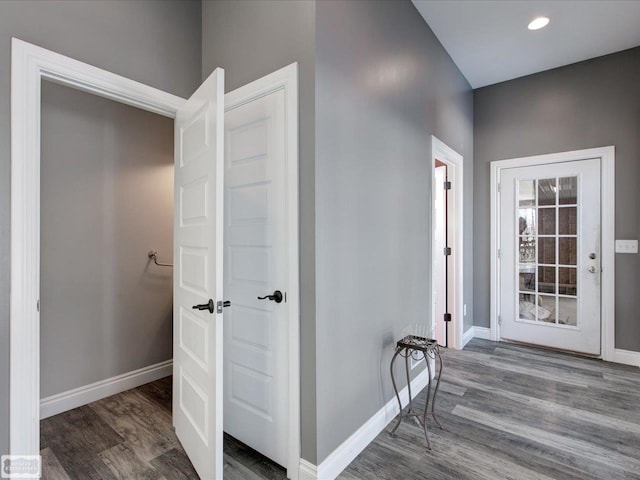 hallway featuring dark hardwood / wood-style flooring