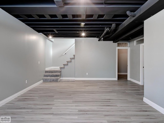 basement featuring light wood-type flooring