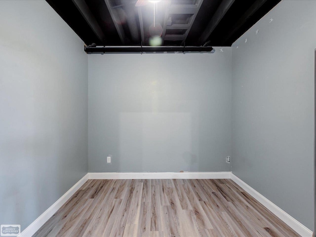 unfurnished room with light wood-type flooring