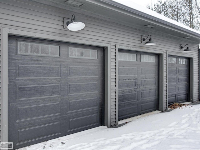 view of snow covered garage