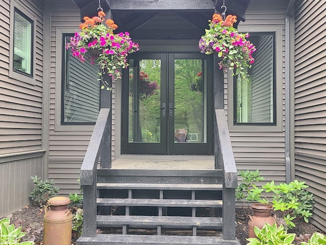 view of exterior entry featuring french doors