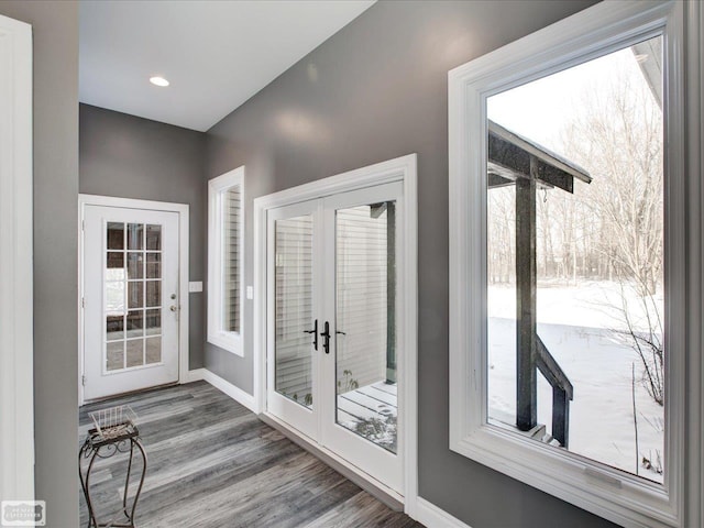 doorway with french doors and hardwood / wood-style flooring