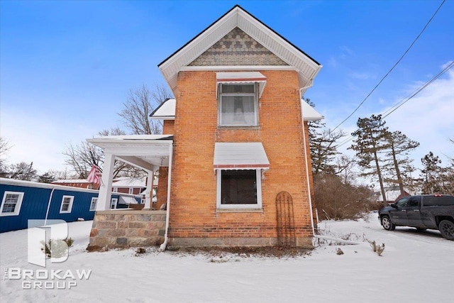 view of snow covered property