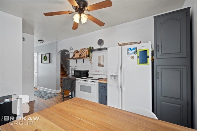 kitchen with white appliances, dark wood-type flooring, and ceiling fan