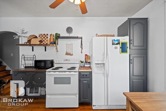 kitchen with white appliances, ceiling fan, dark hardwood / wood-style flooring, and gray cabinetry