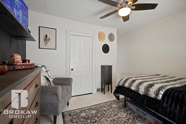 bedroom featuring ceiling fan and light tile patterned flooring