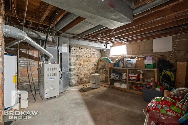 basement with water heater and heating unit