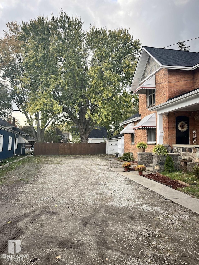 view of side of property with a garage