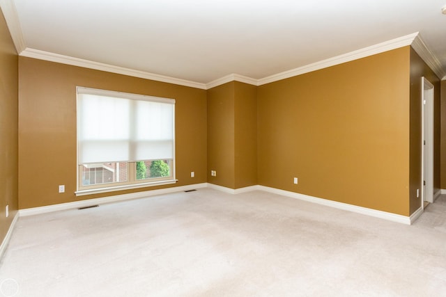 unfurnished room with ornamental molding and carpet floors