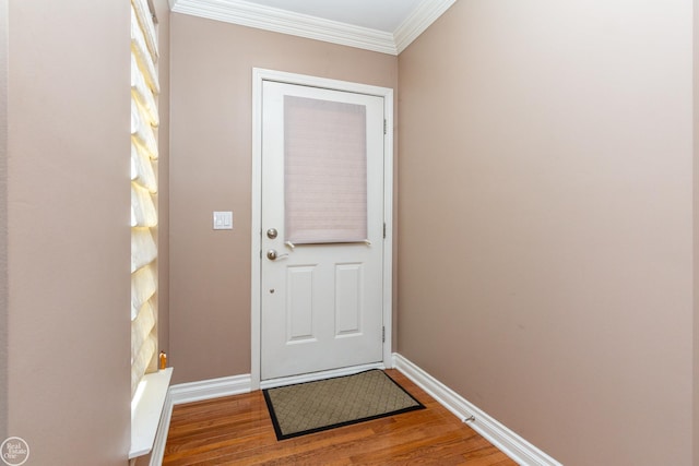 doorway to outside featuring crown molding and wood-type flooring