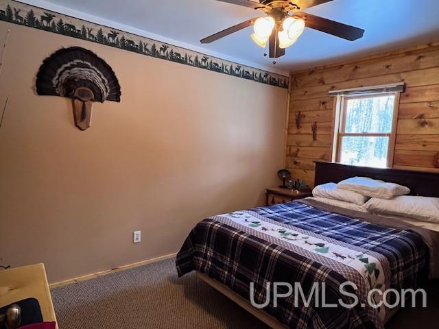 bedroom with ceiling fan and carpet