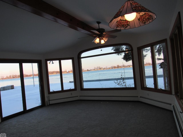 unfurnished sunroom featuring ceiling fan, beam ceiling, a healthy amount of sunlight, and a water view