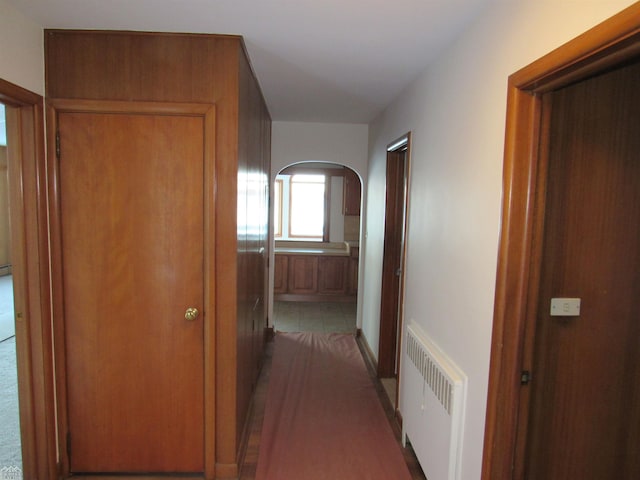 hallway featuring radiator heating unit