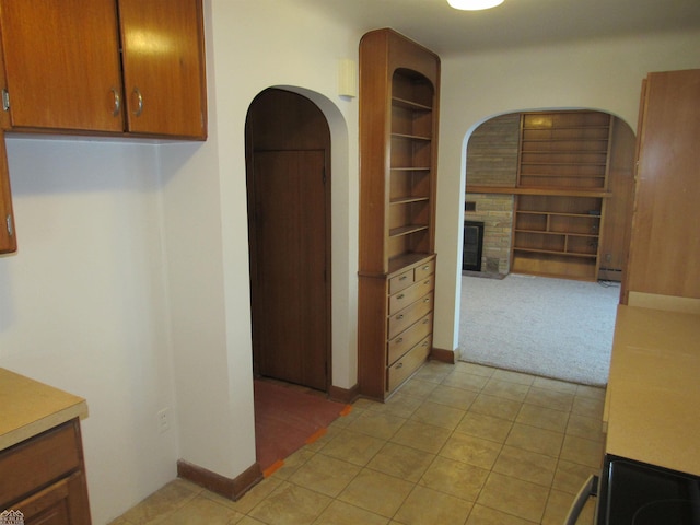 kitchen with light colored carpet