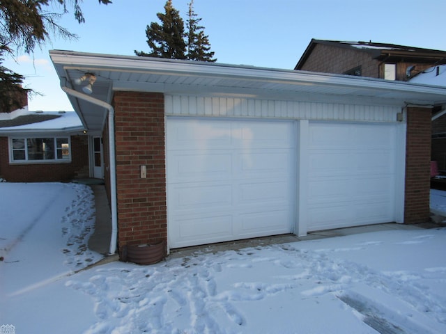 view of snow covered garage