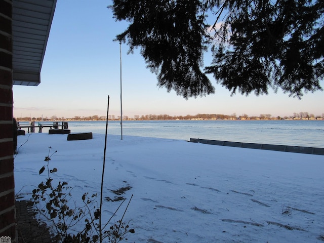 yard at dusk with a water view