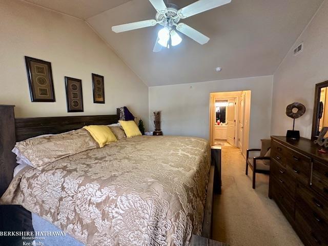 bedroom with ceiling fan, light carpet, and lofted ceiling