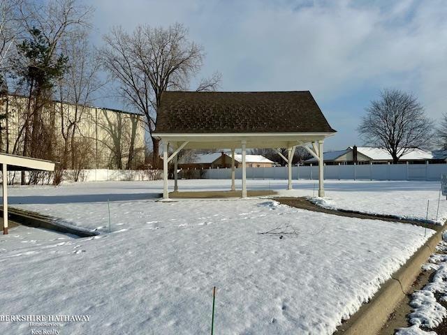 view of yard layered in snow