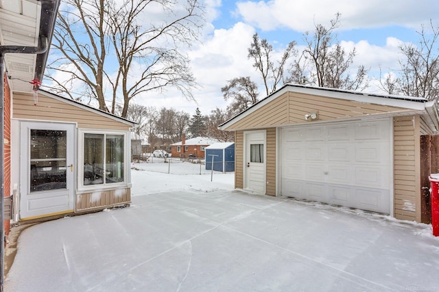 view of snow covered garage