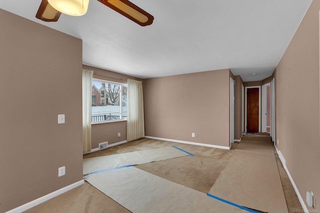 carpeted empty room with ceiling fan