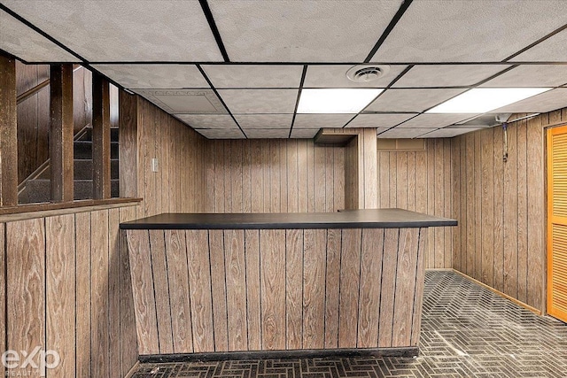 bar featuring wooden walls