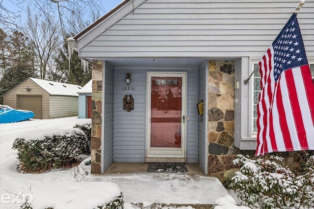 view of snow covered property entrance