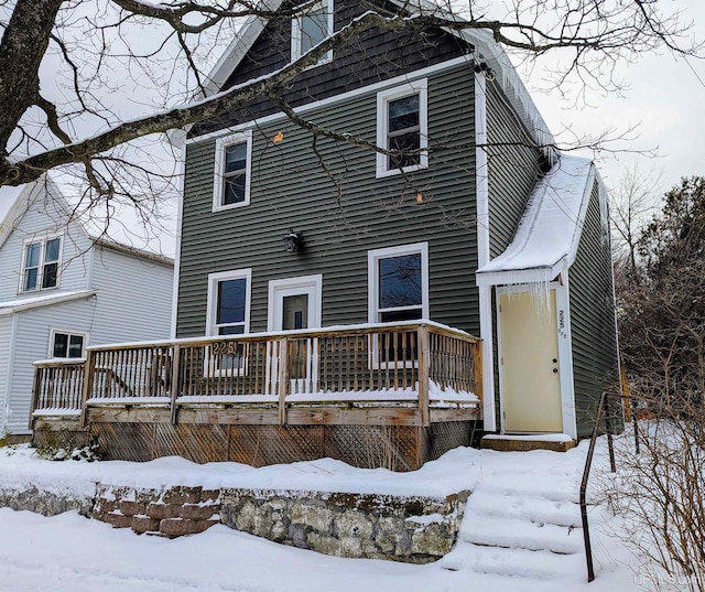 view of snow covered house