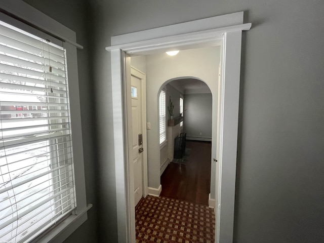 doorway to outside with a baseboard radiator