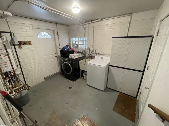 interior space featuring sink and independent washer and dryer