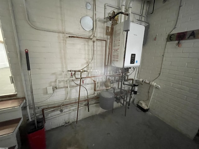 utility room featuring water heater