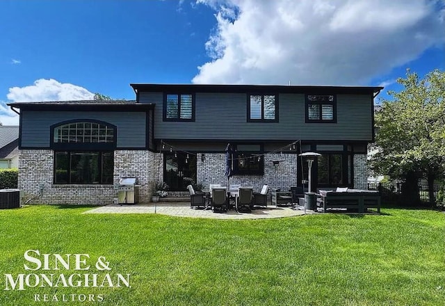 back of house with a lawn, cooling unit, and a patio