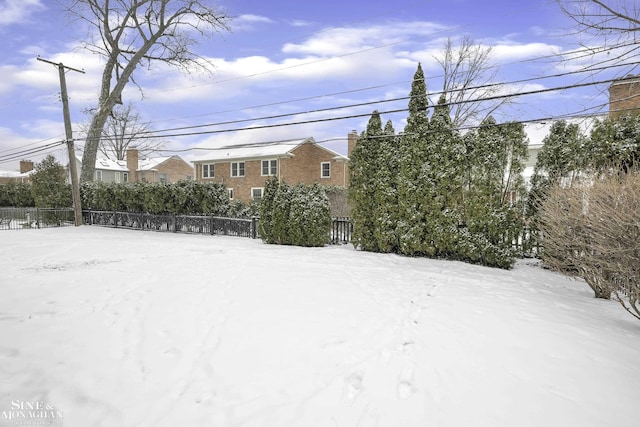 view of yard covered in snow